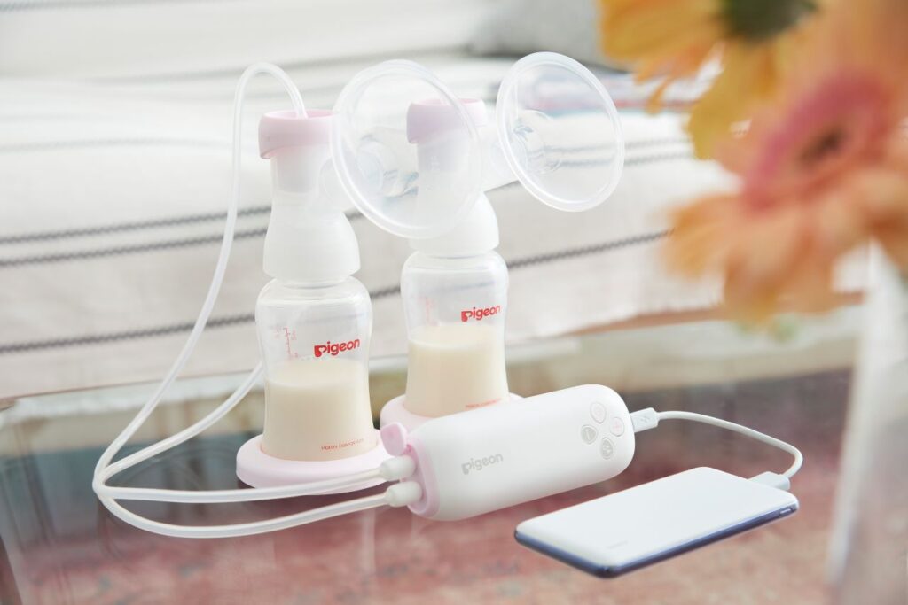 Pigeon GoMini Electric Breast Pump set, featuring compact design and milk storage bottles for easy breastfeeding solutions in Malaysia.